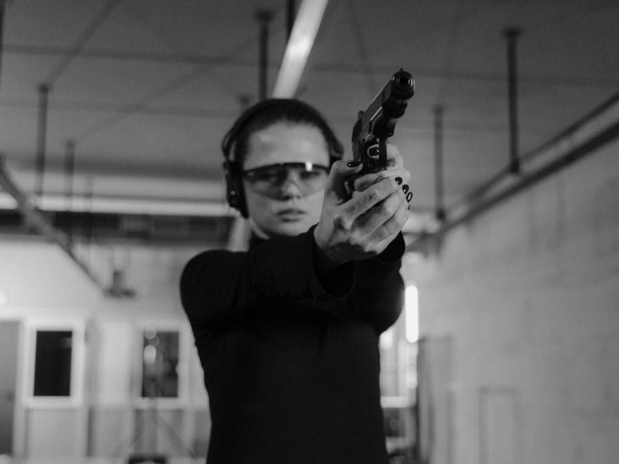 a woman holding a handgun