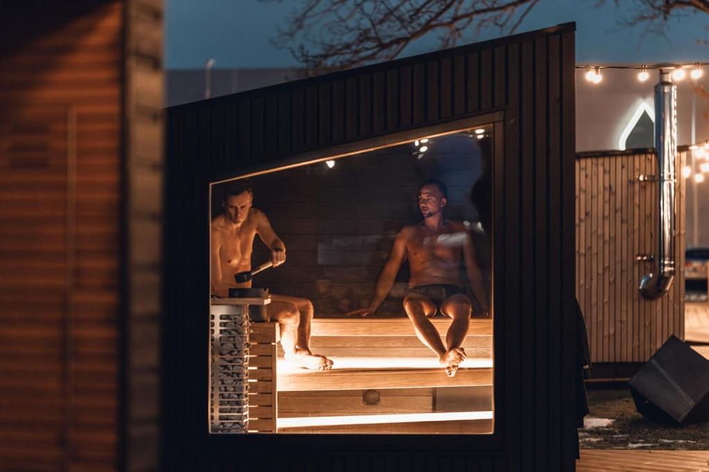 modern nordic style sauna cabin at night